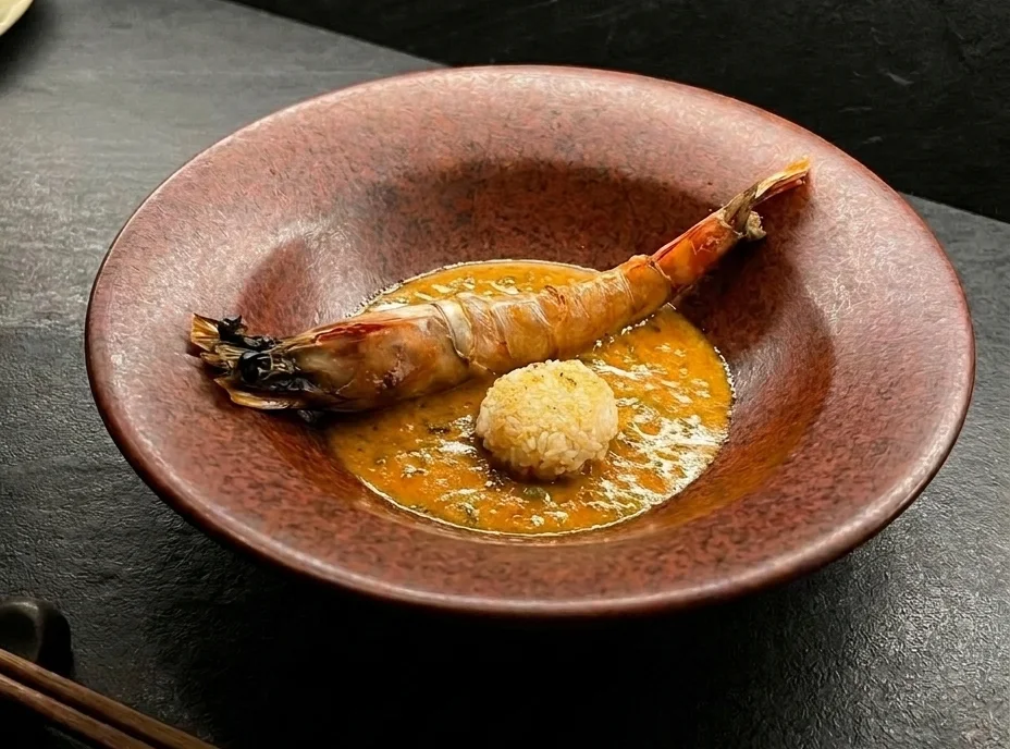 The prawn dish, newly photographed on the slate bar at night