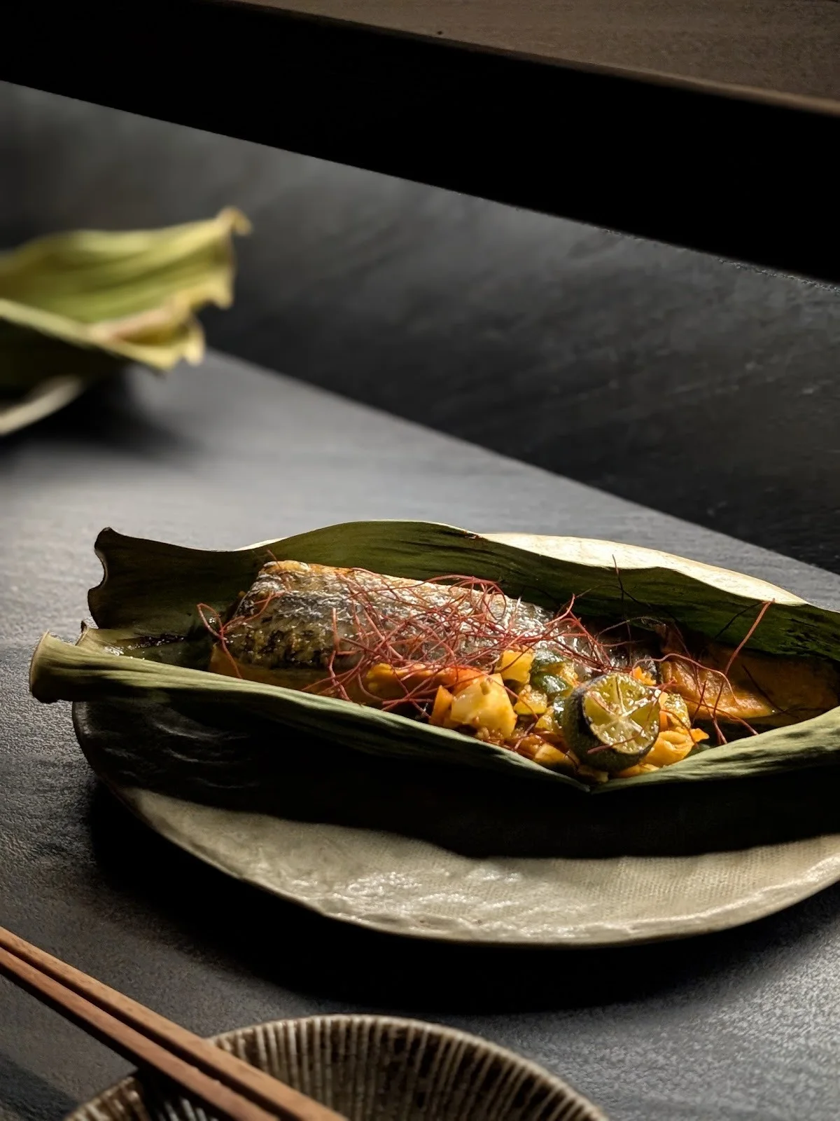 Otak in leaf on black slate