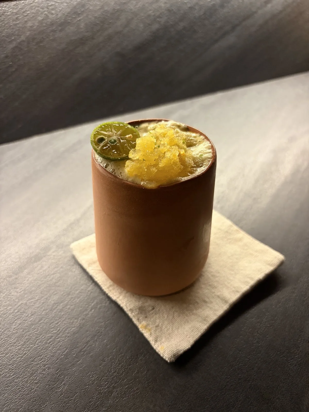 Cocktail in a terracotta clay cup