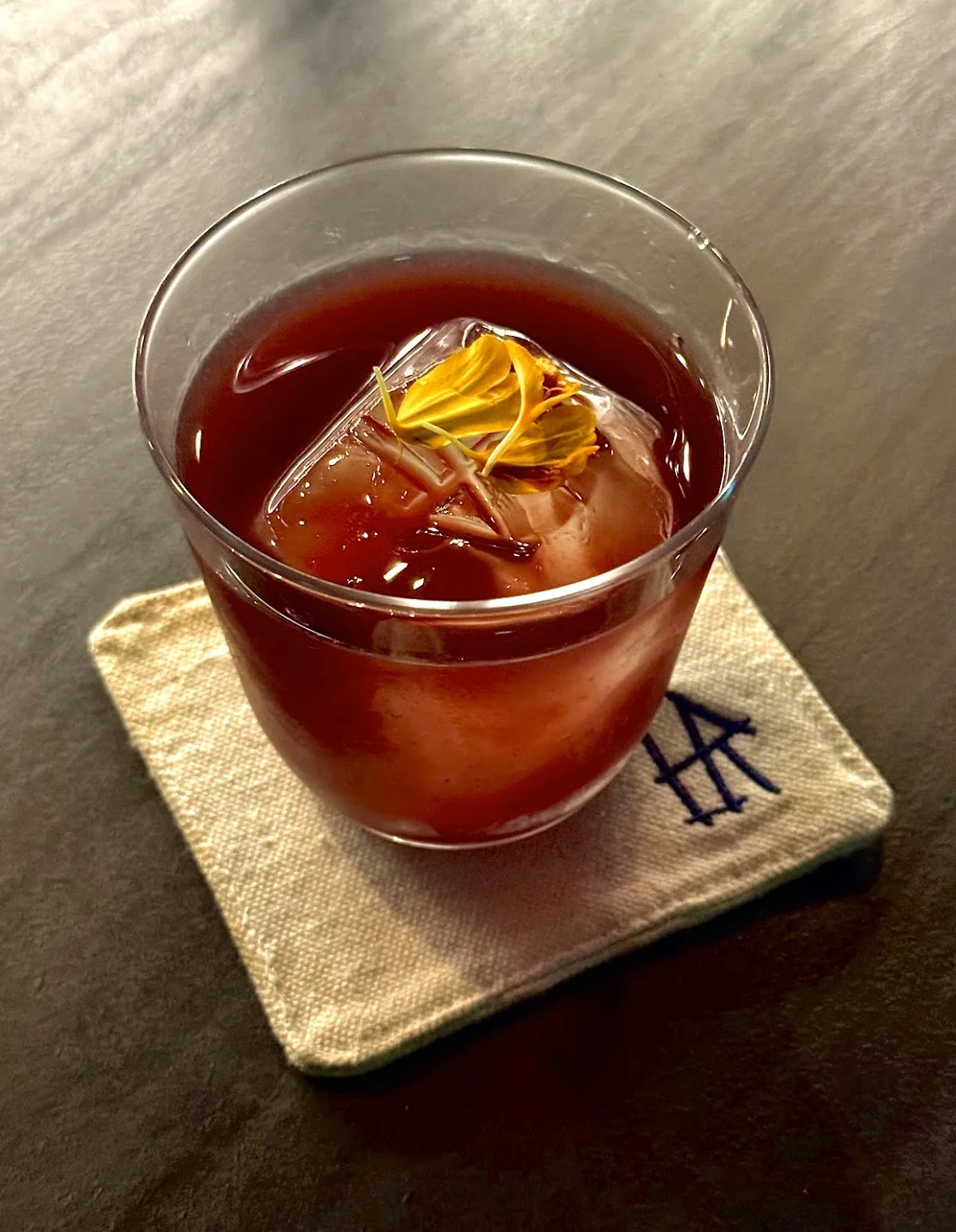 Negroni on an embroidered monogram coaster
