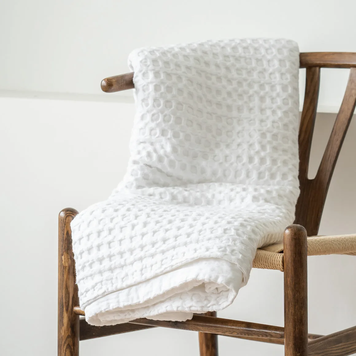 White waffle blanket on chair